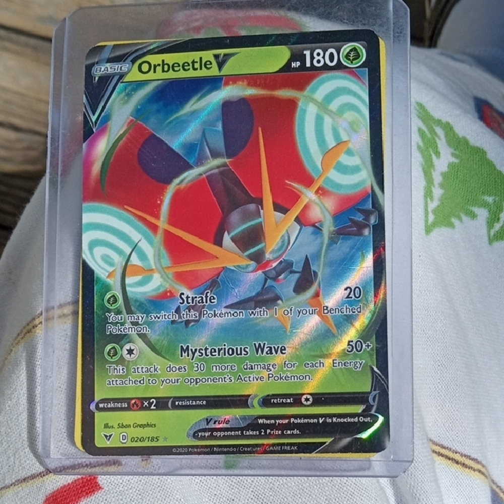 Pokemon Orbeetle Card - Red and Green Hues